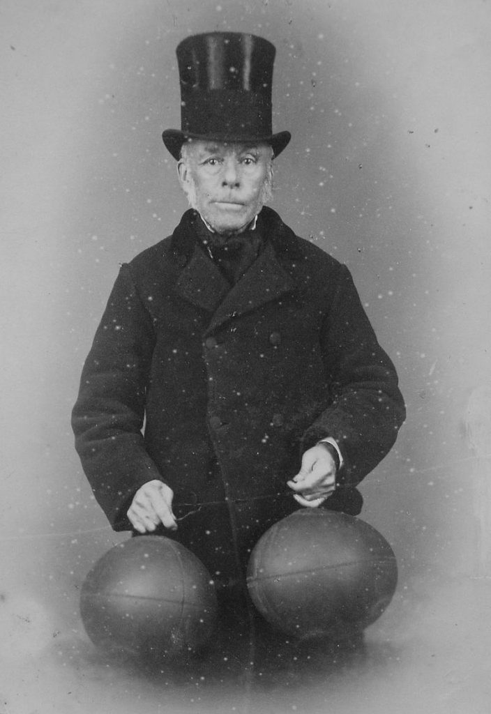 Richard Lindon, believed to have invented the first footballs with rubber bladders, holding the new buttonless balls | soccerfansarena.com